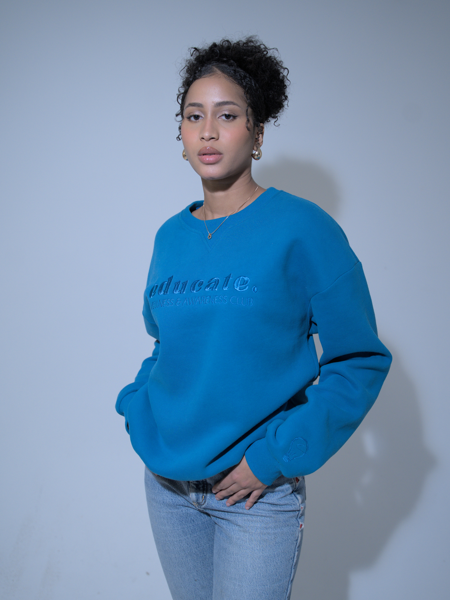 Blue Embroidered EDUCATE Crewneck